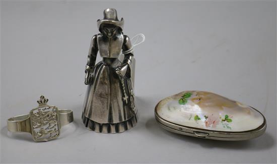 A Norwegian 830 standard silver napkin ring, a plated Dutch girl hand bell and a mounted shell purse.
